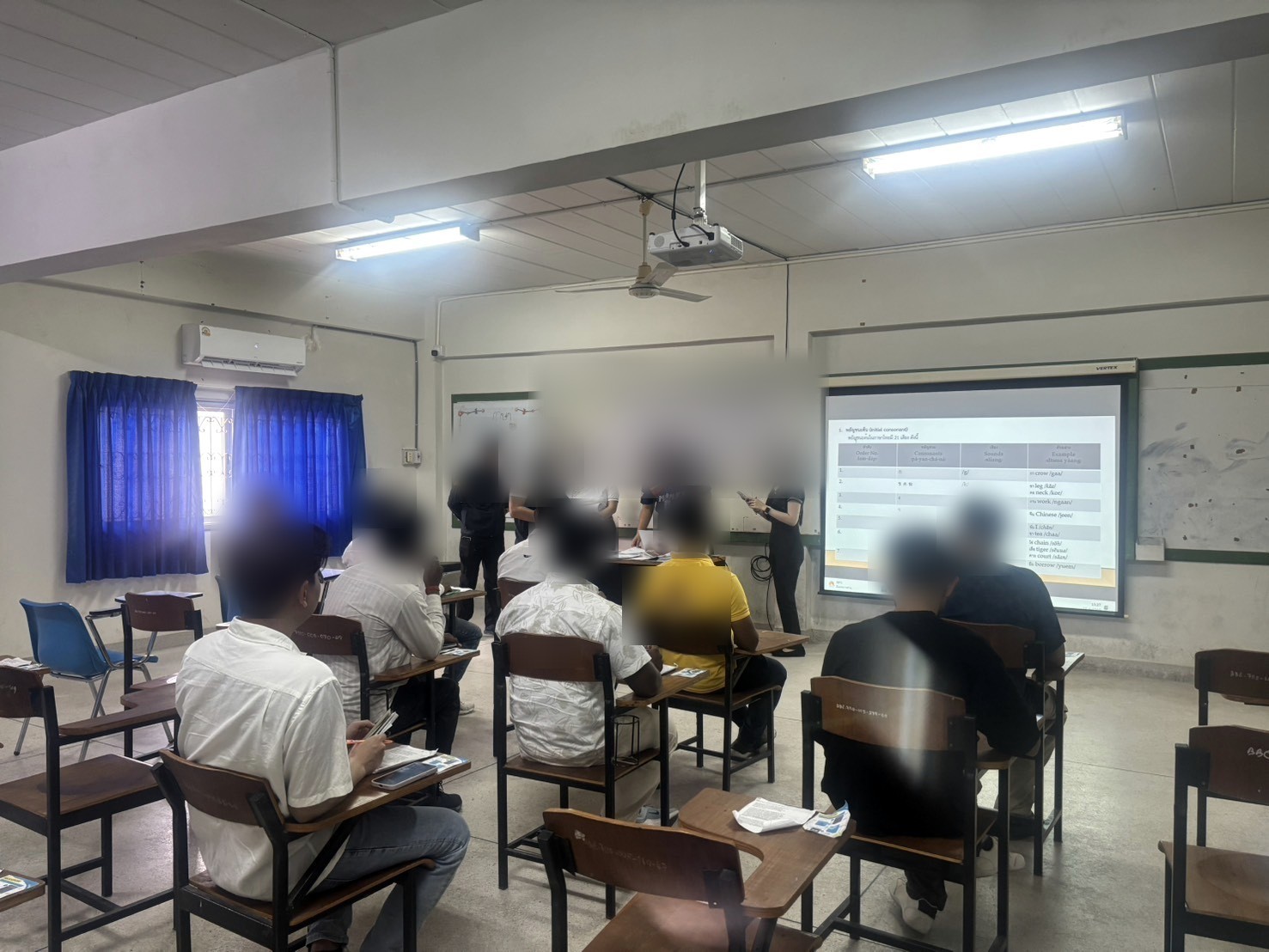 Learners in a Thai language classroom, with faces blurred